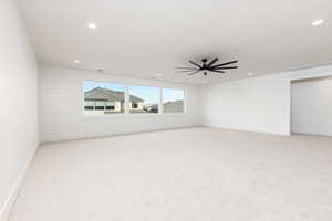 Spare room with light carpet and recessed lighting