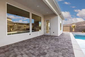 Fenced backyard featuring a patio