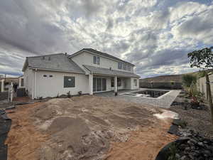 Rear view of house featuring a patio, a fenced backyard, stucco siding, and a tile roof