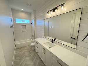 Bathroom with shower / tub combination and vanity