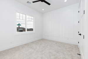 Spare room with carpet floors, recessed lighting, and a ceiling fan