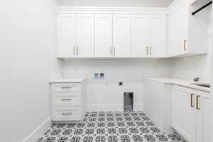 Washroom with hookup for a washing machine and hookup for an electric dryer