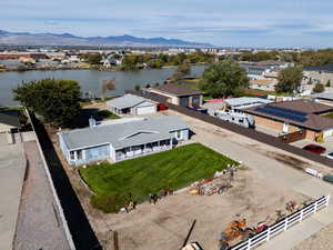 Aerial view of residential area featuring a water and mountain view
