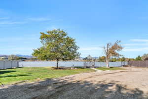 View of yard with a water view
