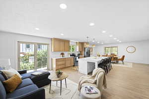 Living room featuring light wood-style floors and recessed lighting