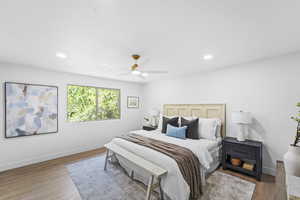Bedroom featuring wood finished floors, recessed lighting, and ceiling fan