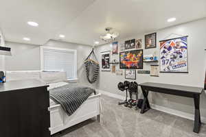 Bedroom with light carpet and recessed lighting