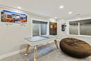 Playroom with recessed lighting and carpet flooring