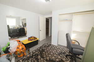 Home office with light wood-style floors and baseboards