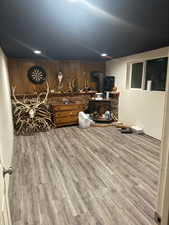 Family room/den/office with new floors and paint along with wood burning stove