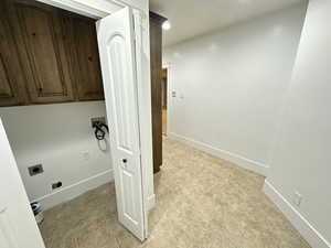 Washroom featuring washer hookup and electric dryer hookup