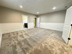 Spare room featuring recessed lighting and light colored carpet
