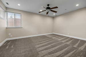Carpeted empty room with recessed lighting and a ceiling fan