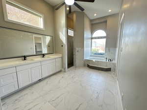 Bathroom with light marble finish flooring, a bath, plenty of natural light, a marble finish shower, and recessed lighting