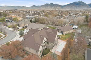 View of property location featuring nearby suburban area and a mountain backdrop