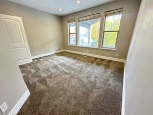 Unfurnished room featuring carpet flooring and recessed lighting