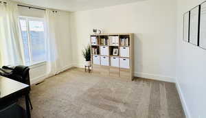 Unfurnished office with carpet and baseboards