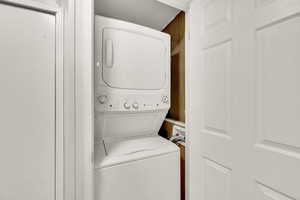 Washroom with stacked washing machine and dryer