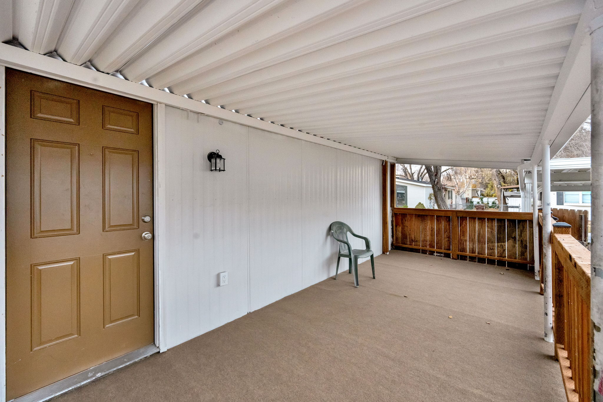 Wooden deck featuring a patio area