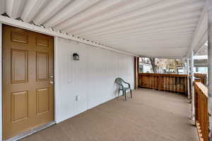Wooden deck featuring a patio area