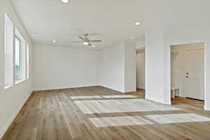 Unfurnished room with recessed lighting, light wood finished floors, and a ceiling fan