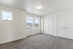 Unfurnished bedroom with two closets