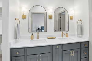 Ensuite bathroom featuring double vanity