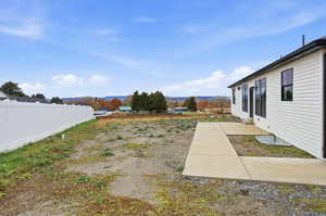 View of yard featuring a patio area and a mountain view