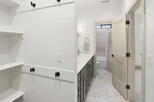 Bathroom with double vanity and shower / bath combo