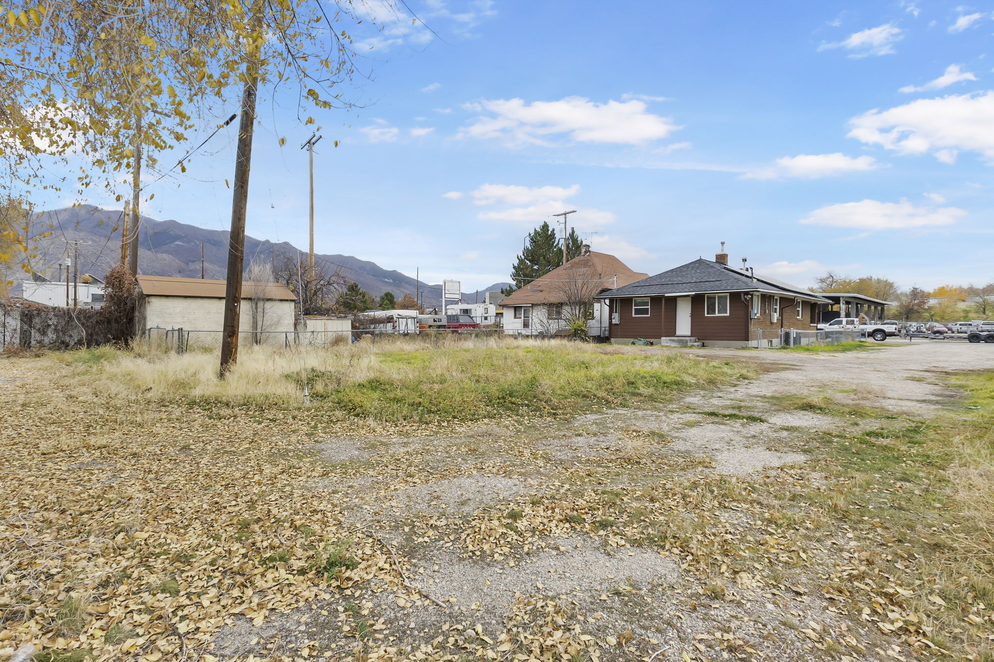 View of home's exterior with a mountain view and a chimney
