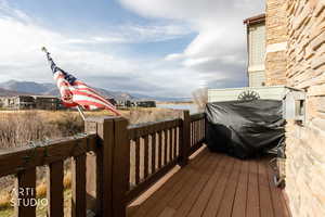 Wooden terrace featuring a mountain view