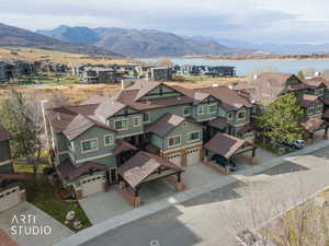 Aerial perspective of suburban area with a water and mountain view