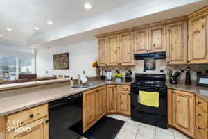 Kitchen featuring black appliances, granite counters, crown molding, under cabinet range hood, and open floor plan