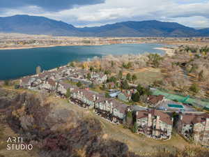 View of property location with nearby suburban area and a water and mountain view