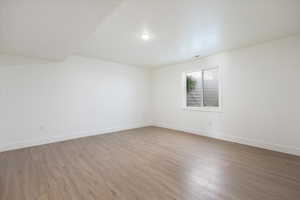 Unfurnished room with light wood-type flooring