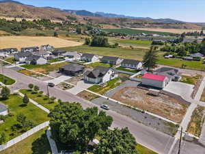 Aerial view of residential area featuring a mountainous background