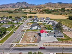 Aerial perspective of suburban area featuring a mountainous background