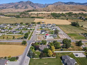 Aerial overview of property's location with nearby suburban area and a mountain backdrop