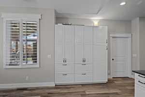 Unfurnished bedroom featuring light wood-type flooring, recessed lighting, and a closet
