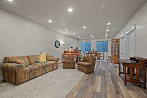 Living area with recessed lighting and wood finished floors