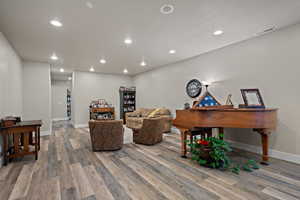 Living area featuring recessed lighting and LVP flooring