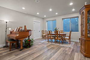 Extension of Living room with recessed lighting and LVP flooring