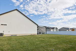 View of yard featuring a trampoline