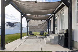 Fenced backyard with a patio area