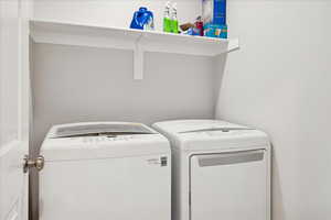 Laundry area with washing machine and clothes dryer
