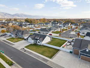 Aerial perspective of suburban area with a mountain backdrop