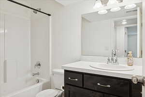 Bathroom with vanity and bathtub / shower combination