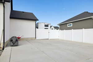 View of patio featuring a gate