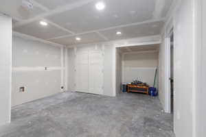 Basement family room with area for a desk.
