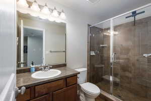 Basement bathroom with walk-in shower.